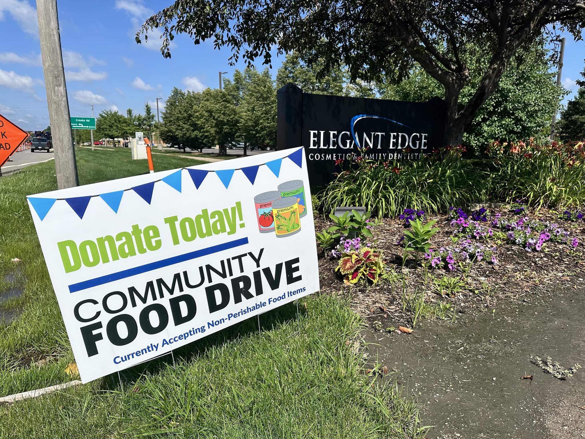 The food drive banner outside Elegant Edge Cosmetic & Family Dentistry's office